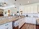 Bright kitchen boasts granite counters, stainless steel appliances and ample countertop seating at 1271 Thoroughbred Trl, Sanford, FL 32771