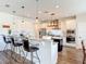 Bright kitchen boasts white cabinets, stainless steel appliances, granite countertops and a breakfast bar with seating at 1271 Thoroughbred Trl, Sanford, FL 32771