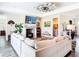 Inviting living room with brick fireplace, wood-look floors, and comfortable seating for relaxation at 1271 Thoroughbred Trl, Sanford, FL 32771
