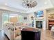 Spacious living room featuring a fireplace, wood-look floors, and sliding doors to the backyard at 1271 Thoroughbred Trl, Sanford, FL 32771