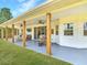 Covered patio with full outdoor furniture set, outdoor TV, and view of the yard at 1271 Thoroughbred Trl, Sanford, FL 32771
