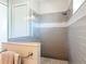 Elegant walk-in shower featuring gray subway tile, a marble accent, a shower head, and glass enclosure at 1271 Thoroughbred Trl, Sanford, FL 32771