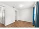Bright, minimalist bedroom with wood-look flooring and ample natural light at 12977 Borland St, Windermere, FL 34786