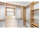 Organized walk-in closet features built-in shelves and drawers at 12977 Borland St, Windermere, FL 34786