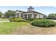 Beautiful clubhouse with manicured landscaping offers a welcoming community gathering space at 12977 Borland St, Windermere, FL 34786