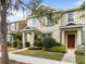 Well-maintained townhome featuring tidy landscaping and a welcoming entrance at 12977 Borland St, Windermere, FL 34786