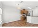 Open-concept kitchen with stainless steel appliances and wood-look flooring at 12977 Borland St, Windermere, FL 34786
