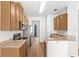 Modern kitchen featuring stainless steel appliances and wood-look flooring at 12977 Borland St, Windermere, FL 34786