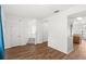 Bright living room featuring wood floors, ample natural light, and a stairway to the second floor at 12977 Borland St, Windermere, FL 34786