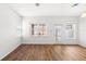 Sun-filled living room has sliding glass doors that provide access to a balcony or patio at 12977 Borland St, Windermere, FL 34786