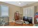 This bedroom features wood floors, and a window at 13111 Meergate Cir, Orlando, FL 32837