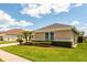 Well-maintained house exterior features a manicured lawn, garden, and neatly trimmed hedges at 13111 Meergate Cir, Orlando, FL 32837