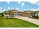 Charming single-story home with a lush green lawn, driveway, and well-maintained landscaping at 13111 Meergate Cir, Orlando, FL 32837