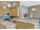 Open-concept kitchen with stainless appliances and ample counter space at 13111 Meergate Cir, Orlando, FL 32837