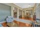 Spacious living room featuring hardwood floors and tile, with decorative furniture pieces and a dining area at 13111 Meergate Cir, Orlando, FL 32837