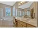 The main bathroom includes a garden tub, walk-in shower, and large vanity area at 13111 Meergate Cir, Orlando, FL 32837