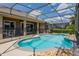 Inviting pool with a screened enclosure, offering privacy and a relaxing outdoor space at 13111 Meergate Cir, Orlando, FL 32837