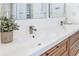 Bathroom featuring double sinks with modern fixtures, a neutral color palette, and ample counter space at 13124 Filly Ct, Windermere, FL 34786