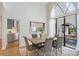 Elegant dining room featuring a dining table, large windows, and natural lighting at 13124 Filly Ct, Windermere, FL 34786