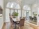 Stunning dining area featuring large windows and stylish decor at 13124 Filly Ct, Windermere, FL 34786