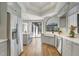 Bright kitchen with stainless steel appliances, large window, and hardwood flooring at 13124 Filly Ct, Windermere, FL 34786