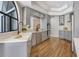 Updated kitchen featuring gray cabinets, stainless steel appliances, and a farmhouse sink at 13124 Filly Ct, Windermere, FL 34786