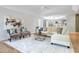 Bright, airy living room with a modern sofa, stylish seating, and an open layout at 13124 Filly Ct, Windermere, FL 34786