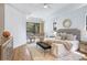 Bright main bedroom with neutral tones, plush carpeting, and a view of the pool area at 13124 Filly Ct, Windermere, FL 34786