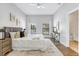 Bright main bedroom with large windows, neutral decor, and stylish furnishings for a serene retreat at 13124 Filly Ct, Windermere, FL 34786