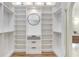 Spacious walk-in closet featuring built-in shelving and drawers for optimal organization at 13124 Filly Ct, Windermere, FL 34786