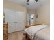 Bedroom featuring neutral colored walls, wood-look floors, and large closet at 13609 Riggs Way, Windermere, FL 34786