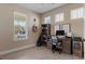 Bright bedroom features wood floors, a built-in desk, and large windows offering ample natural light at 13609 Riggs Way, Windermere, FL 34786