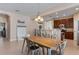 Spacious dining area with a view of the kitchen and front entry at 13609 Riggs Way, Windermere, FL 34786