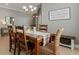 Bright and airy dining space with neutral tones, chandelier, and ample room for gatherings at 13609 Riggs Way, Windermere, FL 34786
