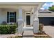 Inviting front entrance with decorative columns and well-kept landscaping adds to the home's curb appeal at 13609 Riggs Way, Windermere, FL 34786