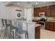 Kitchen featuring stainless steel appliances, granite counters, and breakfast bar with seating at 13609 Riggs Way, Windermere, FL 34786