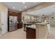 Open concept kitchen with stainless steel appliances and a view of the living area at 13609 Riggs Way, Windermere, FL 34786