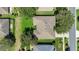 The aerial view shows the roof, lot, and surrounding trees of this single Gathering home at 1375 Willow Wind Dr, Clermont, FL 34711