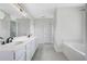 Bright bathroom with double sink vanity, soaking tub, and shower at 1375 Willow Wind Dr, Clermont, FL 34711