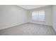 Comfortable bedroom with neutral walls, luxury vinyl flooring, and a window at 1375 Willow Wind Dr, Clermont, FL 34711