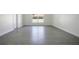 Spacious bedroom with luxury vinyl plank flooring and a large window at 1375 Willow Wind Dr, Clermont, FL 34711