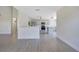 Open-concept view of kitchen and living area with stainless steel appliances and central island at 1375 Willow Wind Dr, Clermont, FL 34711