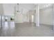 Expansive living space featuring modern flooring, a ceiling fan, and an open floor plan at 1375 Willow Wind Dr, Clermont, FL 34711
