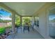 The covered patio offers ample seating and natural light, and the perfect spot for entertaining at 1375 Willow Wind Dr, Clermont, FL 34711