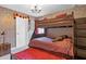 Themed bedroom with bunk beds, stone wallpaper, and Hogwarts decor, perfect for  at 1425 Thunderbird Rd, Davenport, FL 33896
