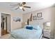Bright and airy bedroom featuring a queen bed, beach-themed decor, and coastal accents at 1425 Thunderbird Rd, Davenport, FL 33896