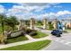 Grand entrance to the Champions Gate community, featuring decorative pillars and beautiful landscaping at 1425 Thunderbird Rd, Davenport, FL 33896