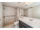 Tiled bathroom featuring a walk-in shower and vanity sink at 150 Waterfall Way # 102, Altamonte Springs, FL 32714