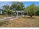 Relax in the community gazebo, surrounded by lush landscaping and mature trees for a serene outdoor experience at 150 Waterfall Way # 102, Altamonte Springs, FL 32714