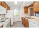 Well-lit kitchen featuring white appliances, light countertops, and modern cabinets at 150 Waterfall Way # 102, Altamonte Springs, FL 32714